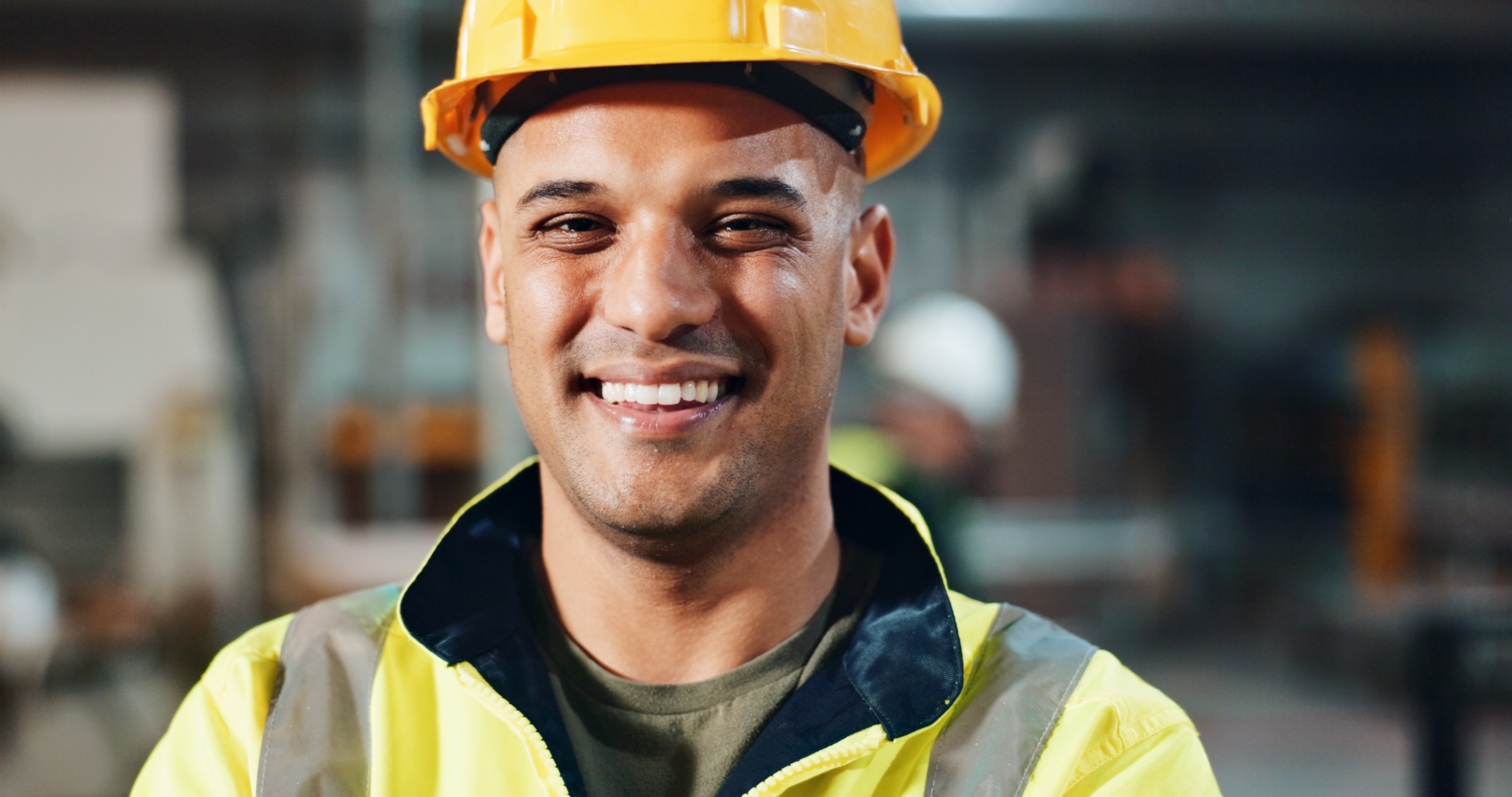 Pro-Tech recruiters shaking hands with a warehouse worker on the production floor